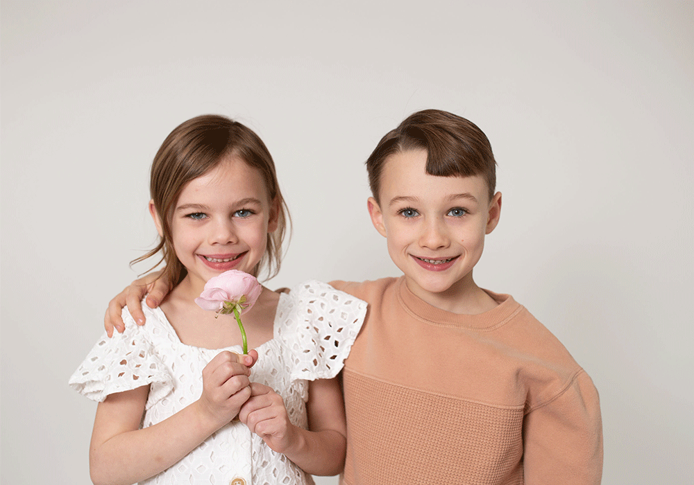 Headshot of two kids smiling.