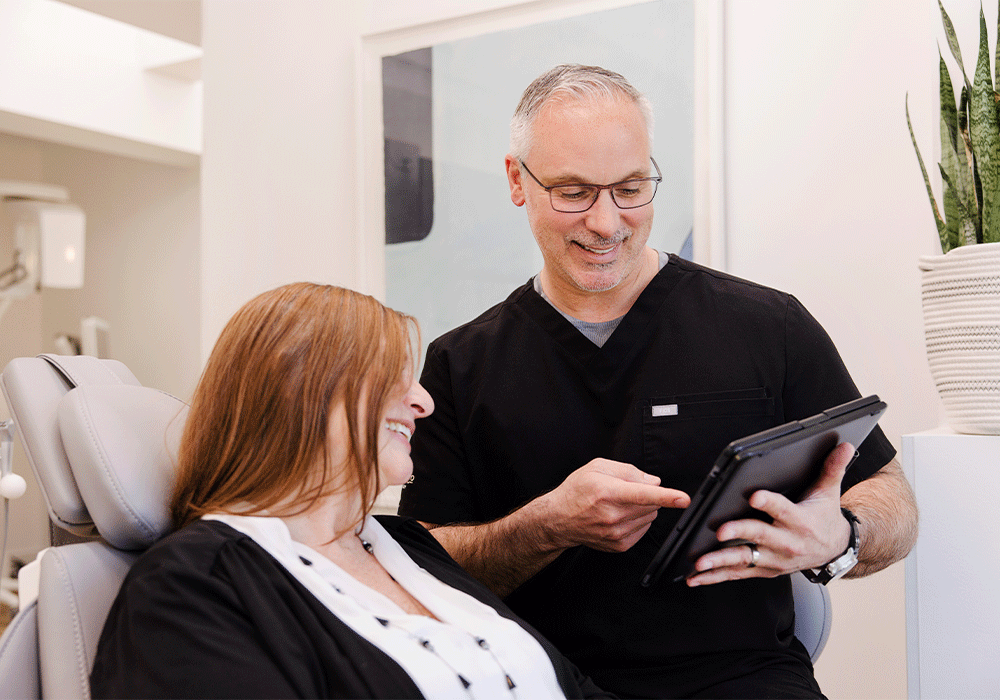 Dr. Wes discussing treatment with a patient.