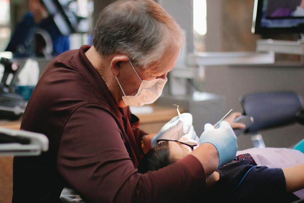Staff from Kansas City Smiles and Co. providing free dental care for children at the Give Kids a Smile® event.