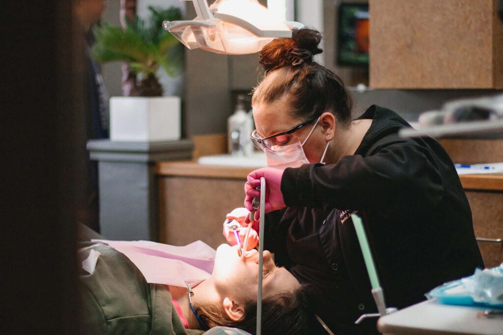 Staff from Kansas City Smiles and Co. providing free dental care for children at the Give Kids a Smile® event.