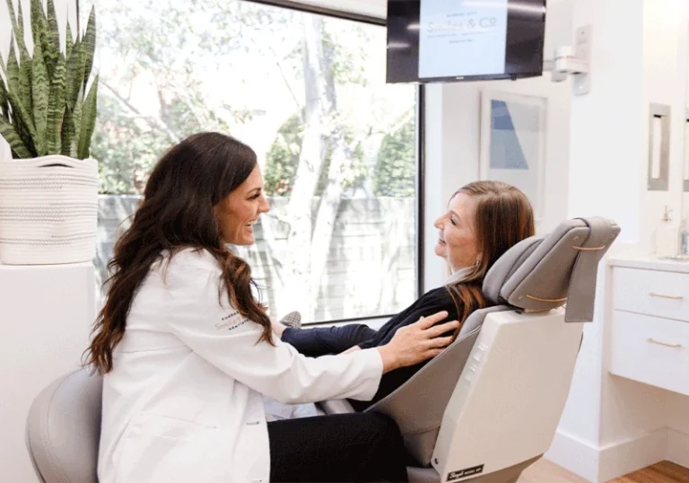 Dr. Nikki talking with patient in exam room.